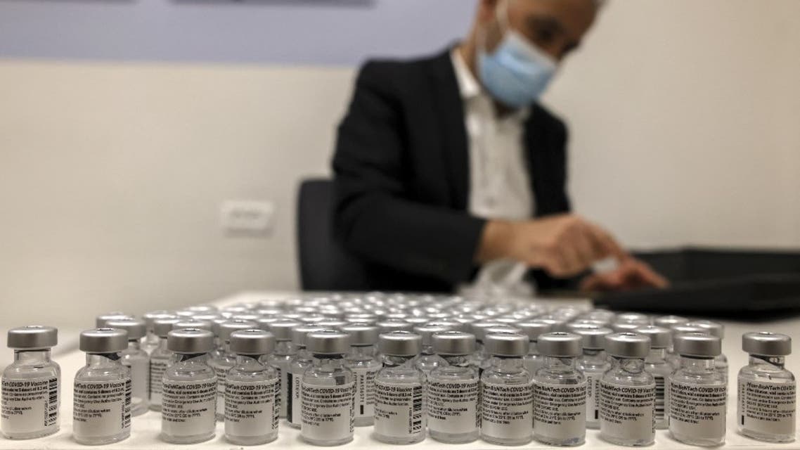 A health worker arranges vials of the Pfizer-BioNtech COVID-19 vaccine at the Clalit Health Services in the Palestinian neighbourhood of Beit Hanina, in the Israeli-annexed east Jerusalem on March 2, 2021. (AFP)