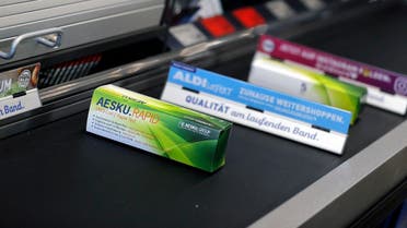 COVID-19 rapid tests are seen on a checkout belt in an ALDI Nord store in Essen, western Germany, on March 05, 2021. (Leon Kuegeler/AFP)
