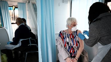 A woman receives a dose of the Oxford-AstraZeneca COVID-19 vaccine in Thamesmead, London, Britain. (Reuters)