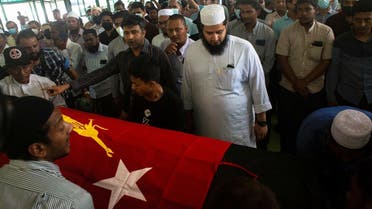 People attend at a funeral of Khin Maung Latt, 58, a National League for Democracy (NLD)'s ward chairman in Yangon, Myanmar March 7, 2021. (Reuters/Stringer)