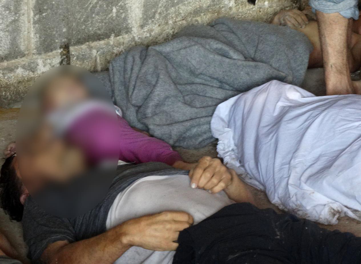 ضحايا مجاز الأسد الكيماوية في الغوطة (فرانس برس)