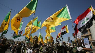 Iraqi Shiite fighters from the Iran-backed armed group, Hezbollah brigades, march during a military parade marking Al-Quds (Jerusalem) International Day in Baghdad, on May 31, 2019. An initiative started by the late Iranian revolutionary leader Ayatollah Ruhollah Khomeini, Quds Day is held annually on the last Friday of the Muslim fasting month of Ramadan and calls for Jerusalem to be returned to the Palestinians .