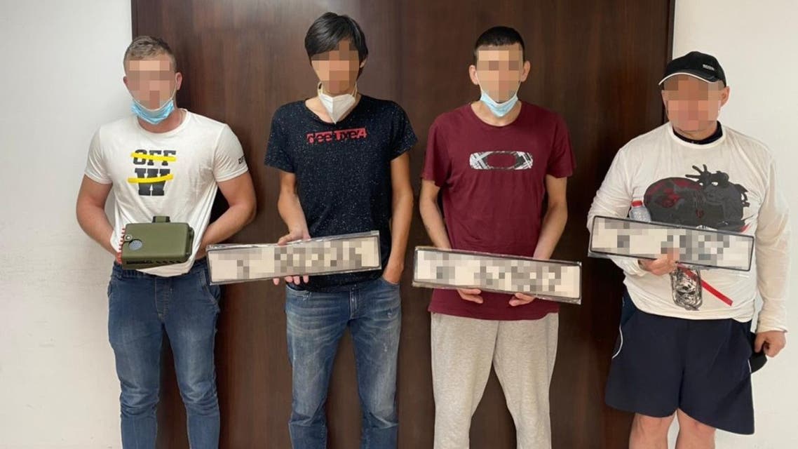 The four suspects (pictured), from the same undisclosed Eastern European country, were arrested on suspicion of planning to smuggle a rented luxury car out of Dubai. (Dubai Police via Facebook)
