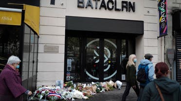 Passers by walk outside the Bataclan concert hall with wreaths of flowers marking the 5th anniversary of the Nov. 13, 2015 attacks, in Paris, Friday, Nov. 13, 2020. (File photo: AP)