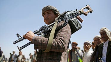 A Shia Houthi tribesman holds his weapon during a gathering showing support for the Houthi militia, in Sanaa, Yemen, Sept. 21, 2019. (AP)