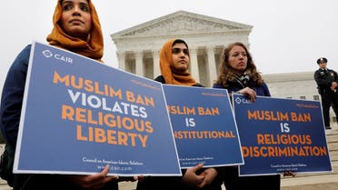 Protesters gather outside the U.S. Supreme Court, while the court justices consider case regarding presidential powers as it weighs the legality of President Donald Trump's latest travel ban targeting people from Muslim-majority countries, in Washington, DC, U.S., April 25, 2018.  (Reuters)