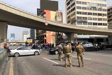 Cars block a highway during a protest against the fall in Lebanese pound currency and mounting economic hardships, in Jal el-Dib, Lebanon March 9, 2021. (Reuters)