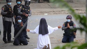 March 9 by the Myitkyina News Journal shows a nun pleading with police not to harm protesters in Myitkyina in Myanmar's Kachin state, amid a crackdown on demonstrations against the military coup. (File photo: AFP)
