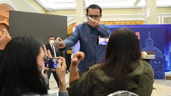 Thai PM sprays reporters with sanitizer
