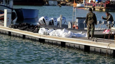 A file photo shows Tunisia's coastguards retrieve the bodies of 20 migrants from sub-Saharan Africa after their boat capsized, at the port of Sfax in central Tunisia on December 24, 2020. (Houssem Zouari/AFP)
