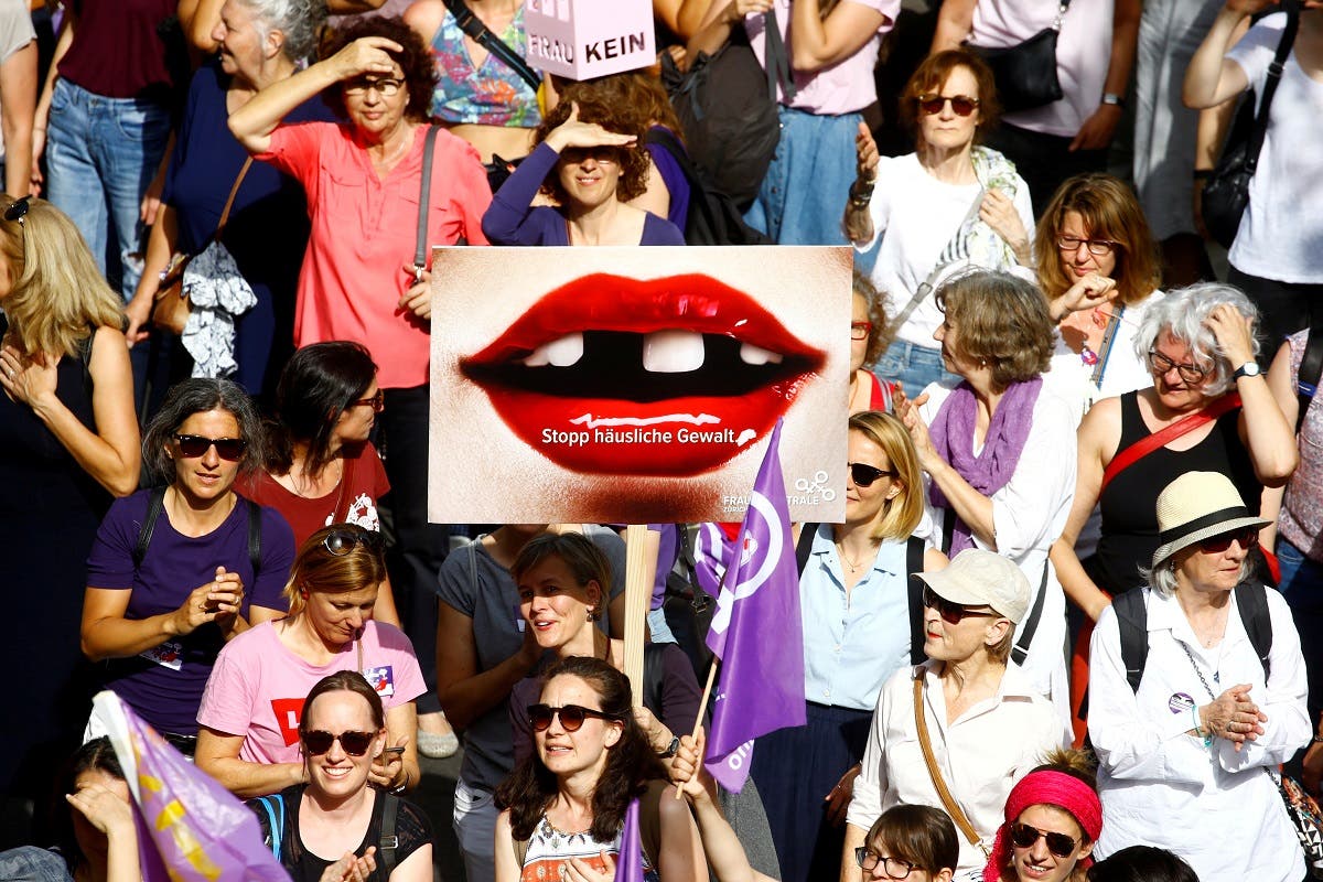 A protester carries a placard reading “Stop domestic abuse” at a demonstration during a women’s strike (Frauenstreik) in Zurich, Switzerland June 14, 2019. (Reuters/Arnd Wiegmann)