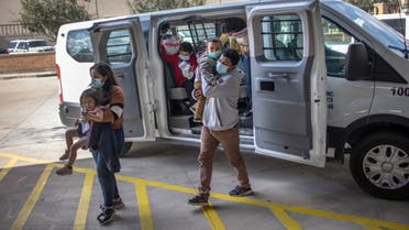 Asylum seekers are released by the U.S. Border Patrol at a bus station on February 26, 2021 in Brownsville, Texas. (AFP)