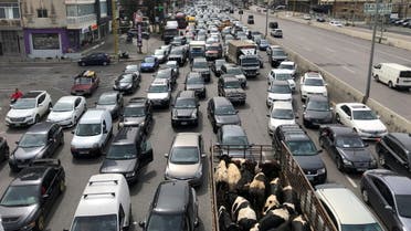 Vehicles are stuck in a traffic jam caused by demonstrators blocking a highway during a protest against the fall in Lebanese pound currency and mounting economic hardships, in Jal el-Dib, Lebanon March 9, 2021. (Reuters)