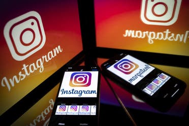 In this file photo taken on September 28, 2020 shows the logo of the social network Instagram on a smartphone and a tablet screen in Toulouse, southwestern France. (AFP)