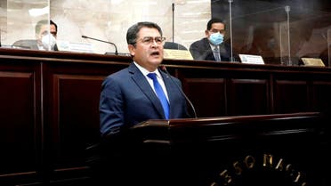 Honduras’ President Juan Orlando Hernandez addresses the Congress to inform about security and organized crime, in Tegucigalpa, Honduras February 24, 2021. (Honduras’ Presidency/Handout via Reuters)
