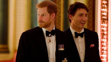 Britain's Prince Harry (L) and Canada's Prime Minister Justin Trudeau arrive to The Queen's Dinner during the Commonwealth Heads of Government Meeting at Buckingham Palace in London, Britain, April 19, 2018. (Reuters)