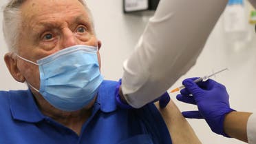 John Healy, a resident of the Wesley Taylor aged care facility, becomes the second person in Australia to receive a dose of the Pfizer/BioNTech Covid-19 vaccine at the Castle Hill Medical Centre in Sydney on February 21, 2021. STEVEN SAPHORE / AFP