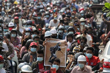People attend the funeral of Angel a 19-year-old protester also known as Kyal Sin who was shot in the head as Myanmar forces opened fire to disperse an anti-coup demonstration in Mandalay, Myanmar, March 4, 2021. (Reuters/Stringer)