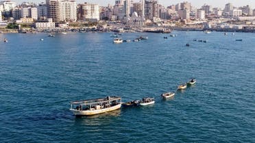 A picture taken with a drone shows Palestinian fishing boats near Gaza's seaport in Gaza City on February 1, 2021. (Reuters)