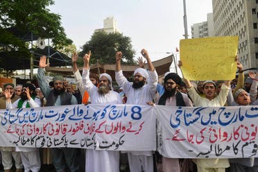 Activists of the Tehreek e Paigham e Mustufa religious party shout slogans during a protest against the recent International Women's Day rallies during a protest, in Karachi on March 12, 2021 following death threats to organisers of Pakistan's International Women's Day rallies after a vicious smear campaign saw doctored images of the event circulate online. (AFP)