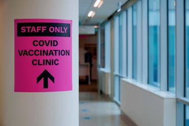 A sign for a COVID-19 vaccination clinic is seen in Melbourne. (Reuters)