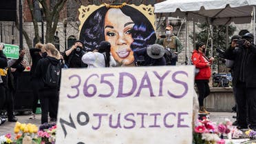 A portrait of Breonna Taylor is seen in front of another protest sign during a protest memorial for her in Jefferson Square Park on March 13, 2021 in Louisville, Kentucky. (Getty Images via AFP)