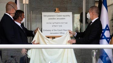 Czech PM Babis, Israeli FM Ashkenazi and Israeli Public Security Minister Amir Ohana unveil a sign during an inauguration ceremony of a Czech diplomatic representation in Jerusalem March 11, 2021. (Sebastian Scheiner/Pool via Reuters)