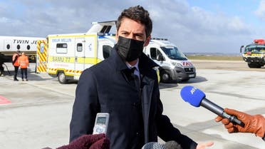 Government spokesperson Gabriel Attal answers journalists’ questions after witnessing the plane transfer of two patients suffering from a severe form of COVID-19 to a hospital in Bordeaux, on March 14, 2021 in Orly. (Jacques Witt/Pool/AFP)