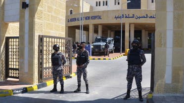 Gendarmerie officers stand guard at the gate of the new Salt government hospital in the city of Salt, Jordan March 13, 2021. (Reuters)
