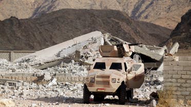 An army personnel carrier is positioned at the site of a police barracks, which was bombed by al Qaeda insurgents in al-Mahfad in the southern Yemeni province of Abyan May 23, 2014. Picture taken May 23, 2014. To match Insight YEMEN-CAMP/ REUTERS/Khaled Abdullah (YEMEN - Tags: MILITARY POLITICS CIVIL UNREST)