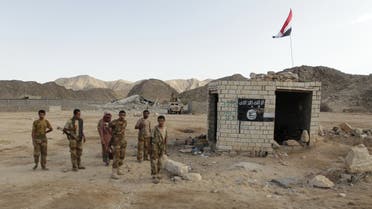 Yemeni soldiers stand at a post which was previously controlled by al Qaeda insurgents in al-Mahfad in the southern province of Abyan May 23, 2014. Picture taken May 23, 2014. To match Insight YEMEN-CAMP/ REUTERS/Khaled Abdullah (YEMEN - Tags: MILITARY POLITICS CIVIL UNREST)