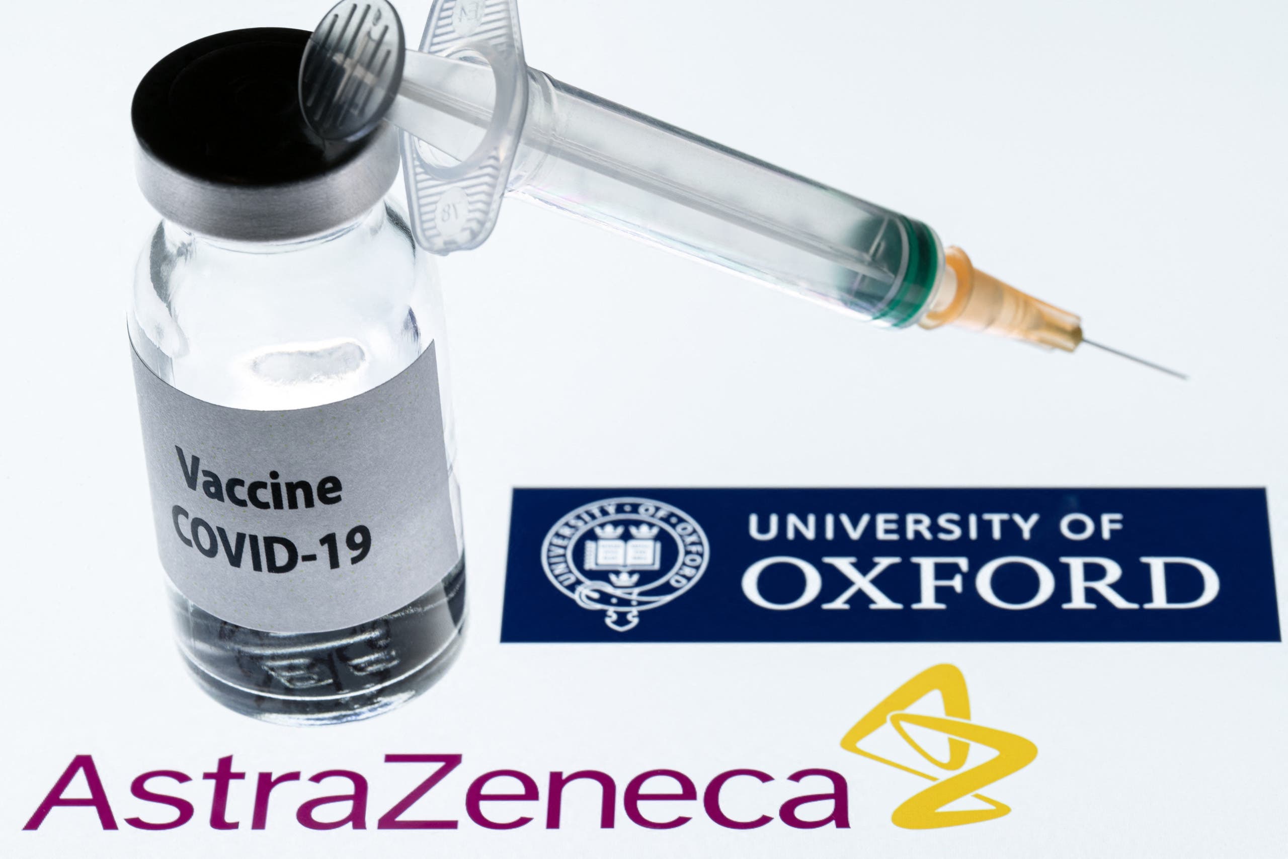 In this file photo taken on November 23, 2020 shows an illustration picture of a syringe and a bottle reading Covid-19 Vaccine next to AstraZeneca company and University of Oxford logos. (File photo: AFP)