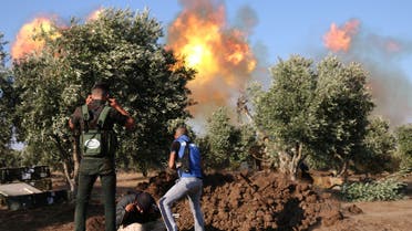 Syrian rebels fire rockets and artillery shells during clashes with regime forces advancing toward the town of al-Hara in the southern Syrian Daraa province on July 16, 2018. Syrian regime forces backed by Russia made sweeping advances today against rebels holding out in the country's vital southern zone. A string of towns ,Al-Hara, Samlin, and Zimrin, had agreed to fall back into regime control, while troops overran Al-Tiha militarily.