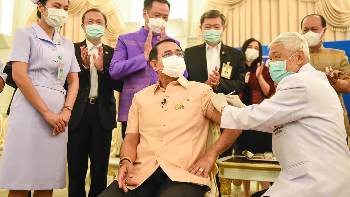 This handout from the Royal Thai Government taken and released on March 16, 2021 shows Thailand's Prime Minister Prayut Chan-O-Cha (C) receiving the Oxford/AstraZeneca Covid-19 coronavirus vaccine in Bangkok. (File photo: AFP)