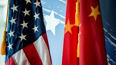 The Chinese and US national flags are seen during a promotional event in Beijing. (File photo: AFP)