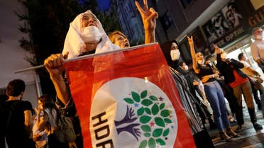 FILE PHOTO: Supporters of pro-Kurdish Peoples Democratic Party (HDP) shout slogans during a protest against the arrest of 82 people including members of their party, in Istanbul, Turkey September 25, 2020. REUTERS/Murad Sezer/File Photo