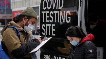 A man signs up to take a coronavirus disease (COVID-19) test at a mobile testing van in Herald Square in New York City, US, on March 16, 2021. (Reuters)