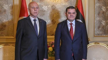 Tunisian President Kais Saied (L) meets with Libya’s new interim Prime Minister Abdul Hamid Dbeibah, in the Libyan capital Tripoli, on March 17, 2021. (AFP)