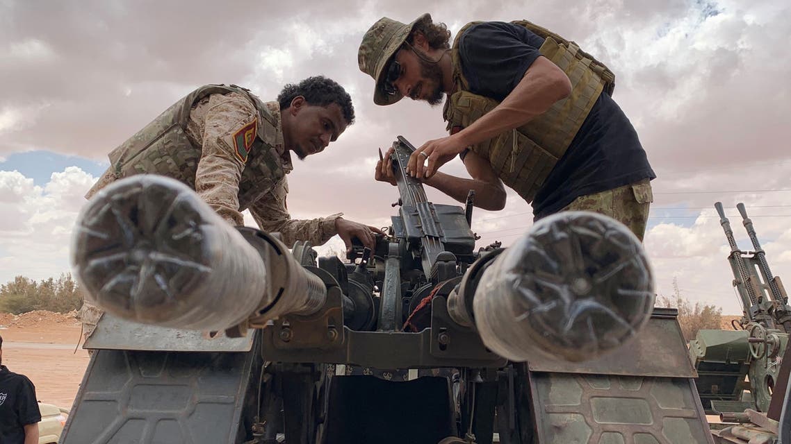 Troops loyal to Libya's internationally recognized government prepare their weapon as they carry out patrols in Zamzam, near Abu Qareen, Libya September 15, 2020. Picture taken September 15, 2020. REUTERS/Ayman Al-Sahili