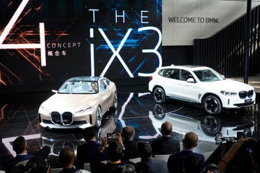  BMW displays its i4 concept car and iX3 electric SUV during the Auto China 2020 show in Beijing on Saturday, Sept. 26, 2020. (AP)