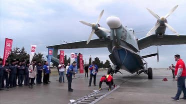 Crimean powerlifter Dzhamshid Ismatillayev set a Russian record on Tuesday (March 16) for pulling a 31.5 ton amphibious aircraft over the distance of a meter. (Screengrab)