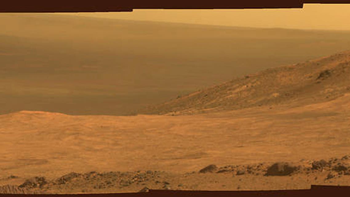 A view from NASA's Mars Exploration Rover Opportunity shows part of Marathon Valley, a destination on the western rim of Endeavour Crater on the planet Mars, as seen from an overlook north of the valley in this NASA composite handout photo provided March 24, 2015. The scene combines four pointings of the rover's panoramic camera (Pancam) on March 13, 2015 on NASA's Mars Reconnaissance Orbiter yielded evidence of clay minerals, a clue to ancient wet environments, according to NASA. REUTERS/NASA/Handout via Reuters ATTENTION EDITORS - FOR EDITORIAL USE ONLY. NOT FOR SALE FOR MARKETING OR ADVERTISING CAMPAIGNS. THIS PICTURE WAS PROVIDED BY A THIRD PARTY. REUTERS IS UNABLE TO INDEPENDENTLY VERIFY THE AUTHENTICITY, CONTENT, LOCATION OR DATE OF THIS IMAGE. THIS PICTURE IS DISTRIBUTED EXACTLY AS RECEIVED BY REUTERS, AS A SERVICE TO CLIENTS