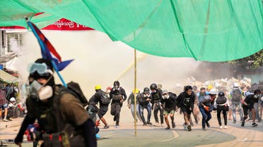 Protesters run during a crackdown of an anti-coup protests at Hlaing Township in Yangon, Myanmar March 17, 2021. Picture taken March 17, 2021. (File photo: Reuters)
