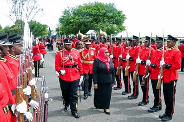 Tanzania’s new President Samia Suluhu Hassan inspects a guard of honor mounted by the Tanzania Peoples Defense Forces after she was sworn into office following the death of her predecessor at State House in Dar es Salaam, Tanzania, on March 19, 2021. (Reuters)