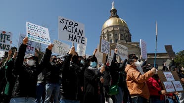 People hold placards during a “Stop Asian Hate” rally, following the deadly shootings, in Atlanta, Georgia, US, on March 20, 2021. (Reuters)