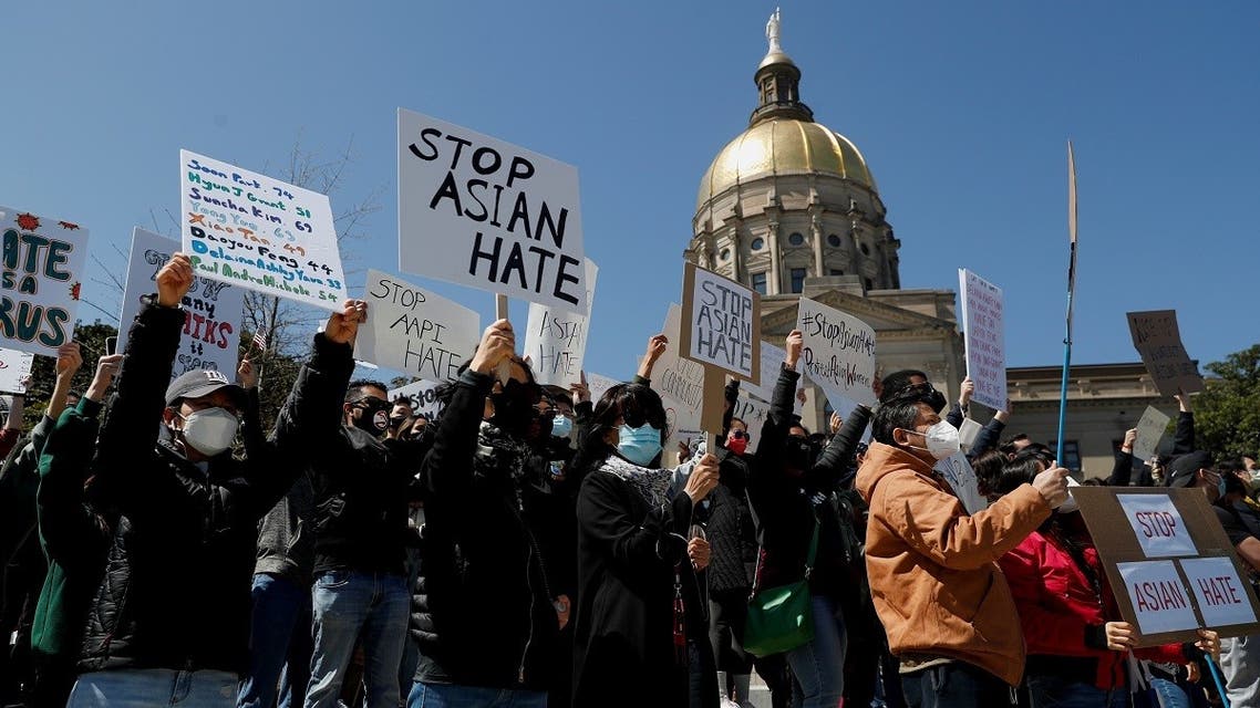 People hold placards during a “Stop Asian Hate” rally, following the deadly shootings, in Atlanta, Georgia, US, on March 20, 2021. (Reuters)