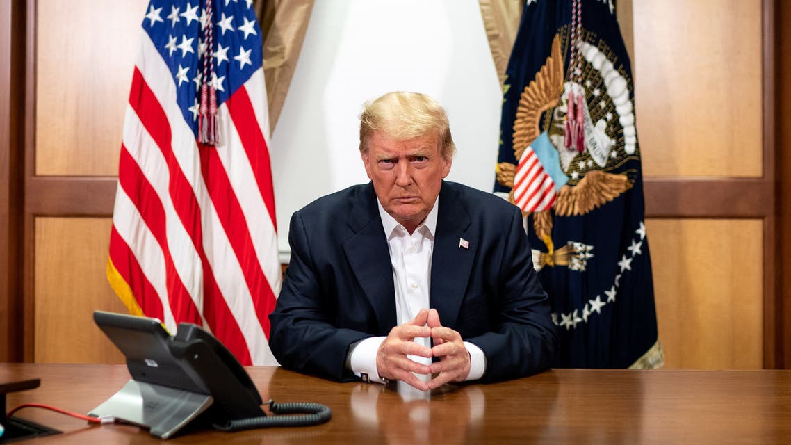 This handout photo released by the White House shows US President Donald Trump and his Chief of Staff (not pictured) participating in a phone call with the US Vice President, Secretary of State and Chairman of the Joint Chiefs of Staff on October 4, 2020, in his conference room at Walter Reed National Military Medical Center in Bethesda, Maryland. President Donald Trump has continued to improve as he is treated for Covid-19 at a military hospital near Washington, his doctors said October 4, adding that he could be discharged as early as October 5.