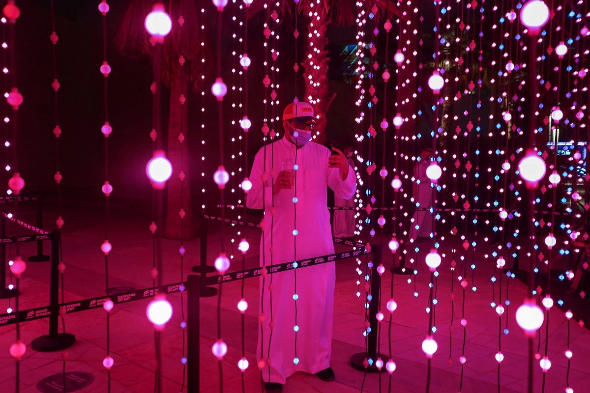 A visitor looks on during 'Noor Riyadh' festival of light, in Riyadh, Saudi Arabia March 19, 2021. (Reuters)