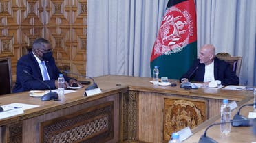 Afghanistan’s President Ashraf Ghani (R) meets US Secretary of Defense Lloyd Austin, in Kabul, Afghanistan March 21, 2021. (Presidential Palace/Handout via Reuters) 