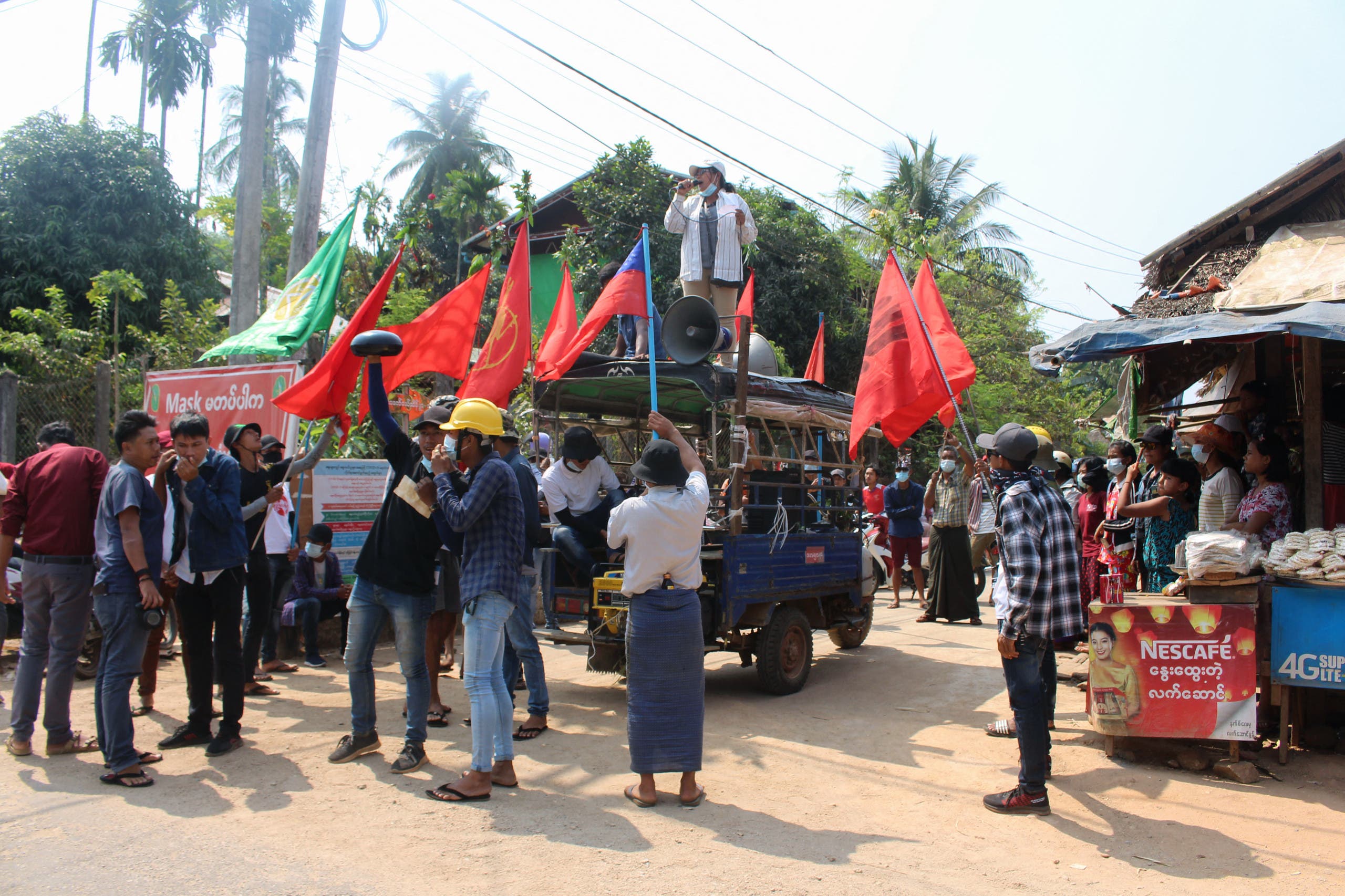 This handout photo taken and released by Dawei Watch on March 21, 2021 shows protesters taking part in a demonstration against the military coup in Launglone township in Myanmar's Dawei district.